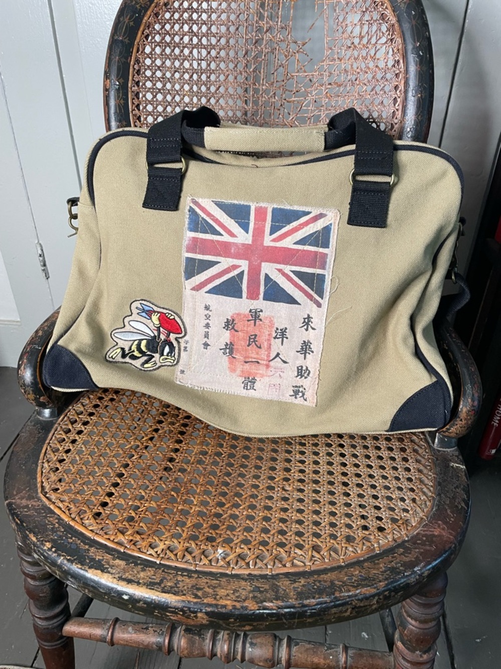 Canvas travel bag with WW II planes and emblems.